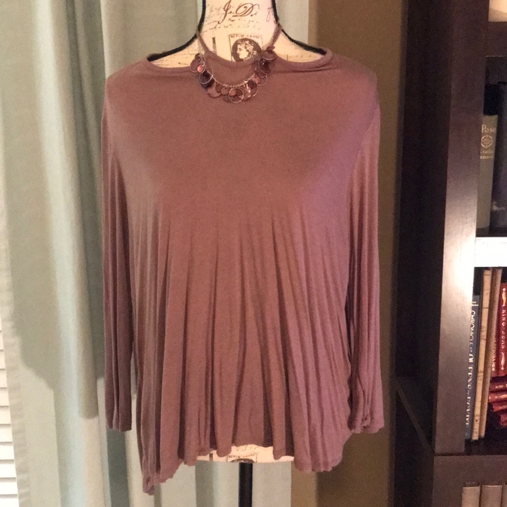 Taupe blouse with crossed neckline.
